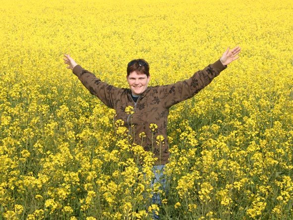 Ramona Rubach - playful in a field of canola in the Western Cape